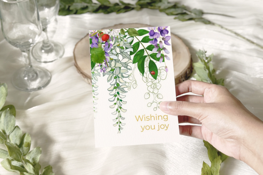 10 blank cards with envelopes.  'Wishing you joy'