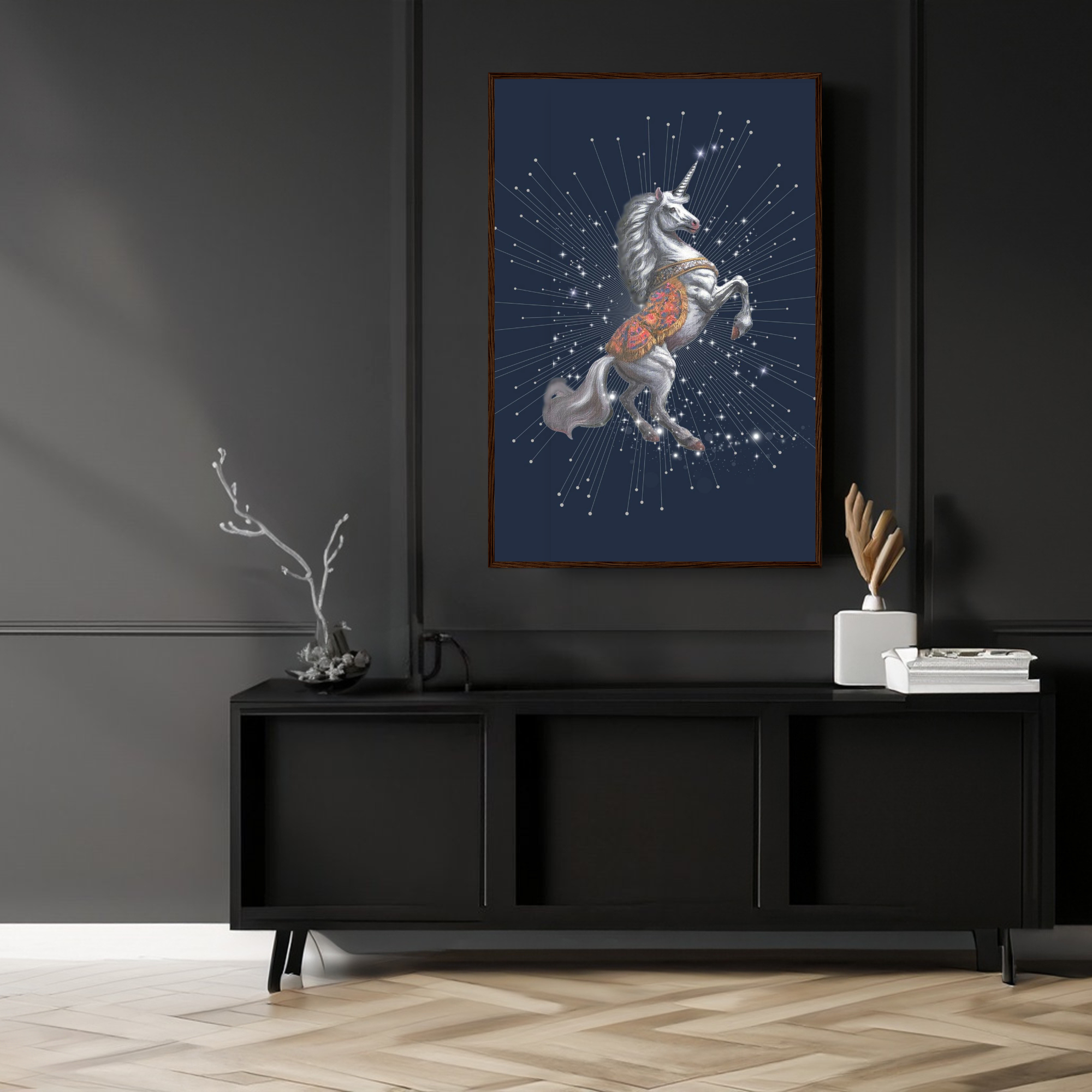 Framed artwork of a unicorn with starry background on a dark wall above a black cabinet.